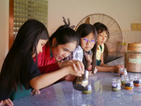 Group of students making candles