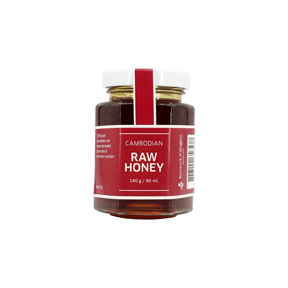 Cambodian raw honey in hexagonal glass jar, front