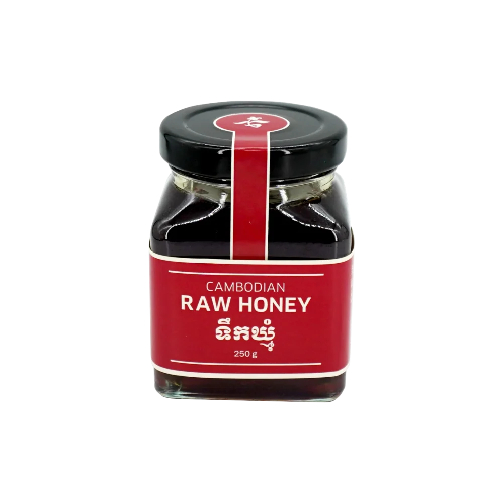 Raw honey in big square glass jar