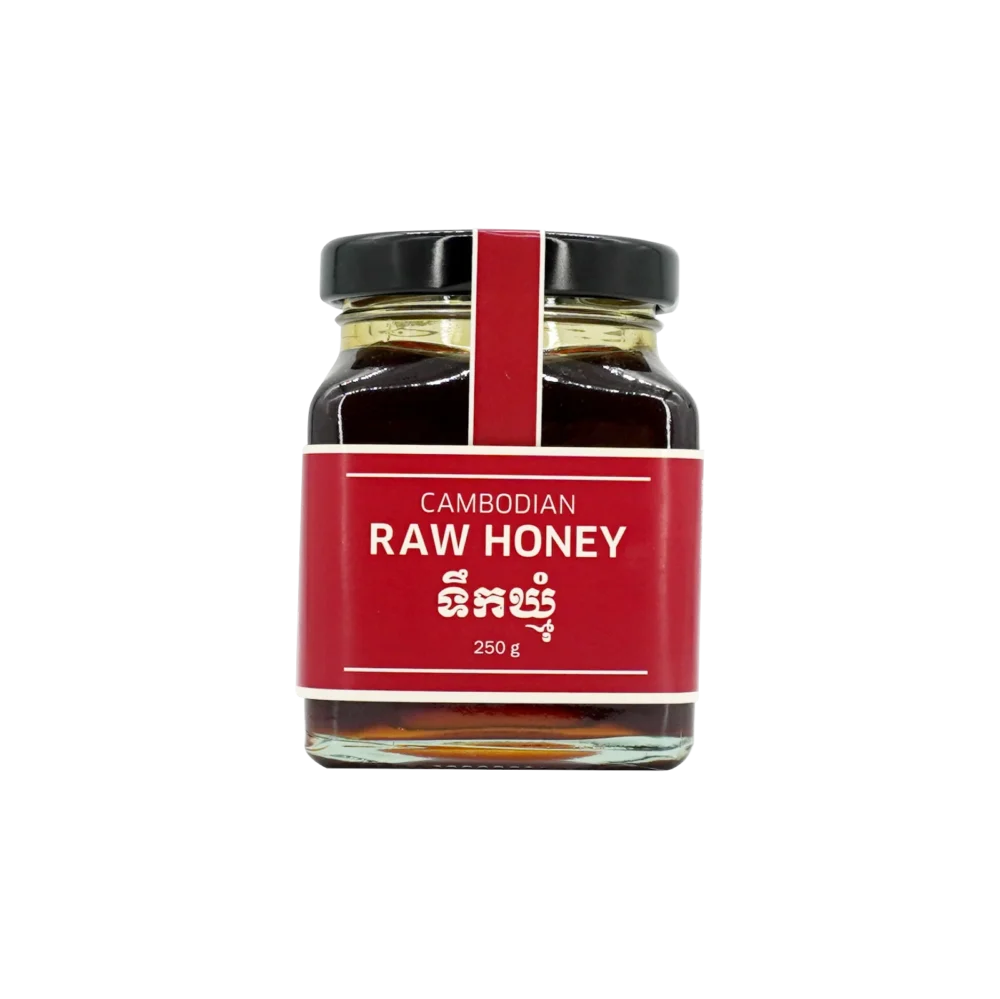 Cambodian raw honey in big square glass jar, front