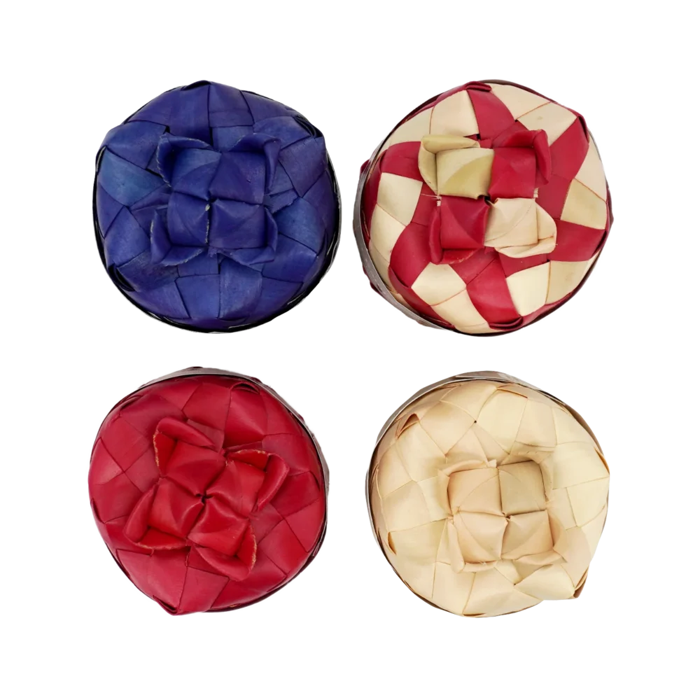 Kampot pepper in sugar palm leaf (smok) box, all peppers top view