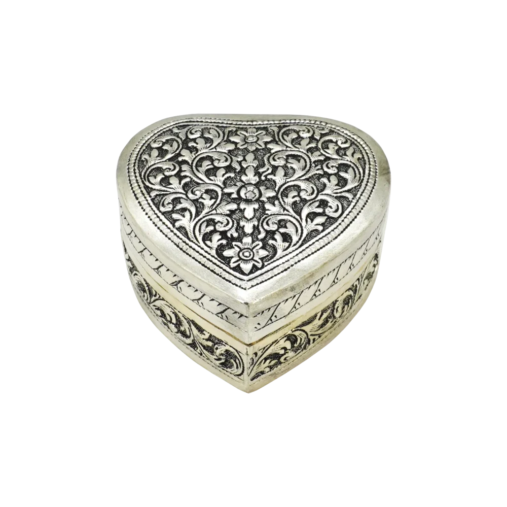 Candle in engraved silver heart shaped box, closed
