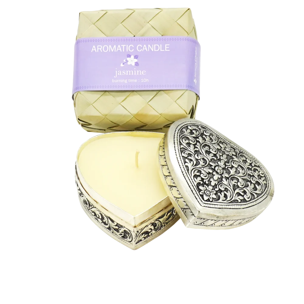 Candle in engraved silver heart shaped box, displayed