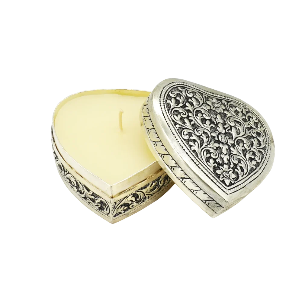 Candle in engraved silver heart shaped box, opened