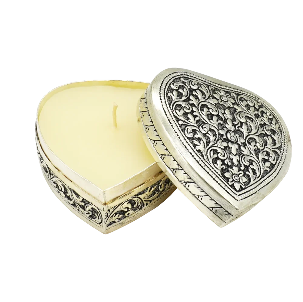 Candle in engraved silver heart shaped box, opened