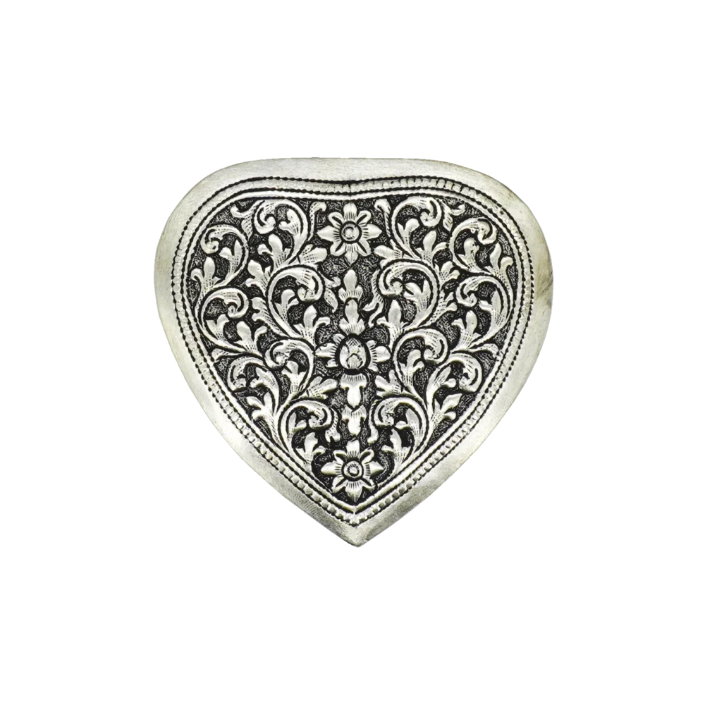 Candle in engraved silver heart shaped box, top view