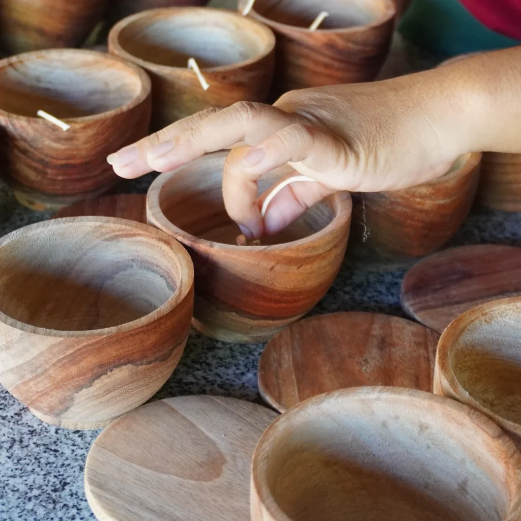 Array of candles in wood