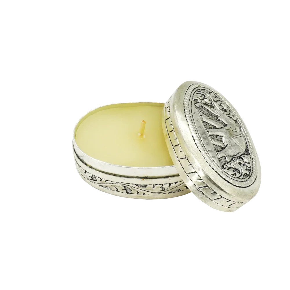Candle in engraved elephant silver oval box, opened