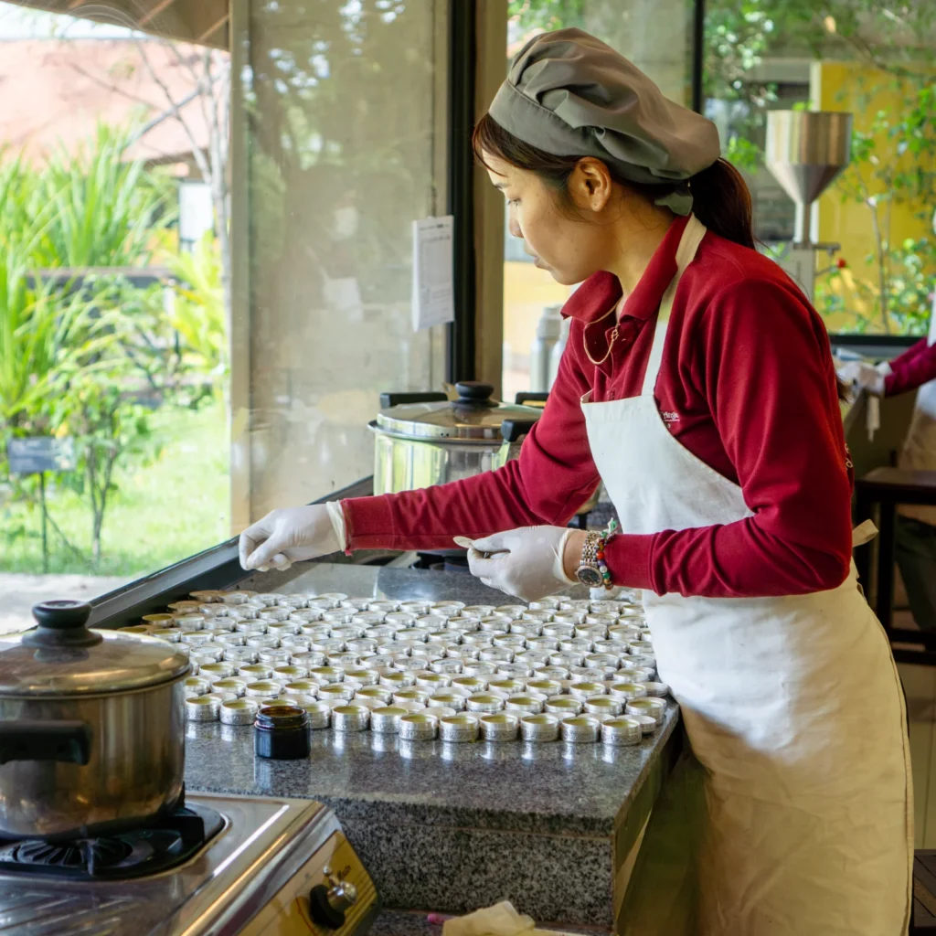 Artisan places a tracing paper layer for protection.