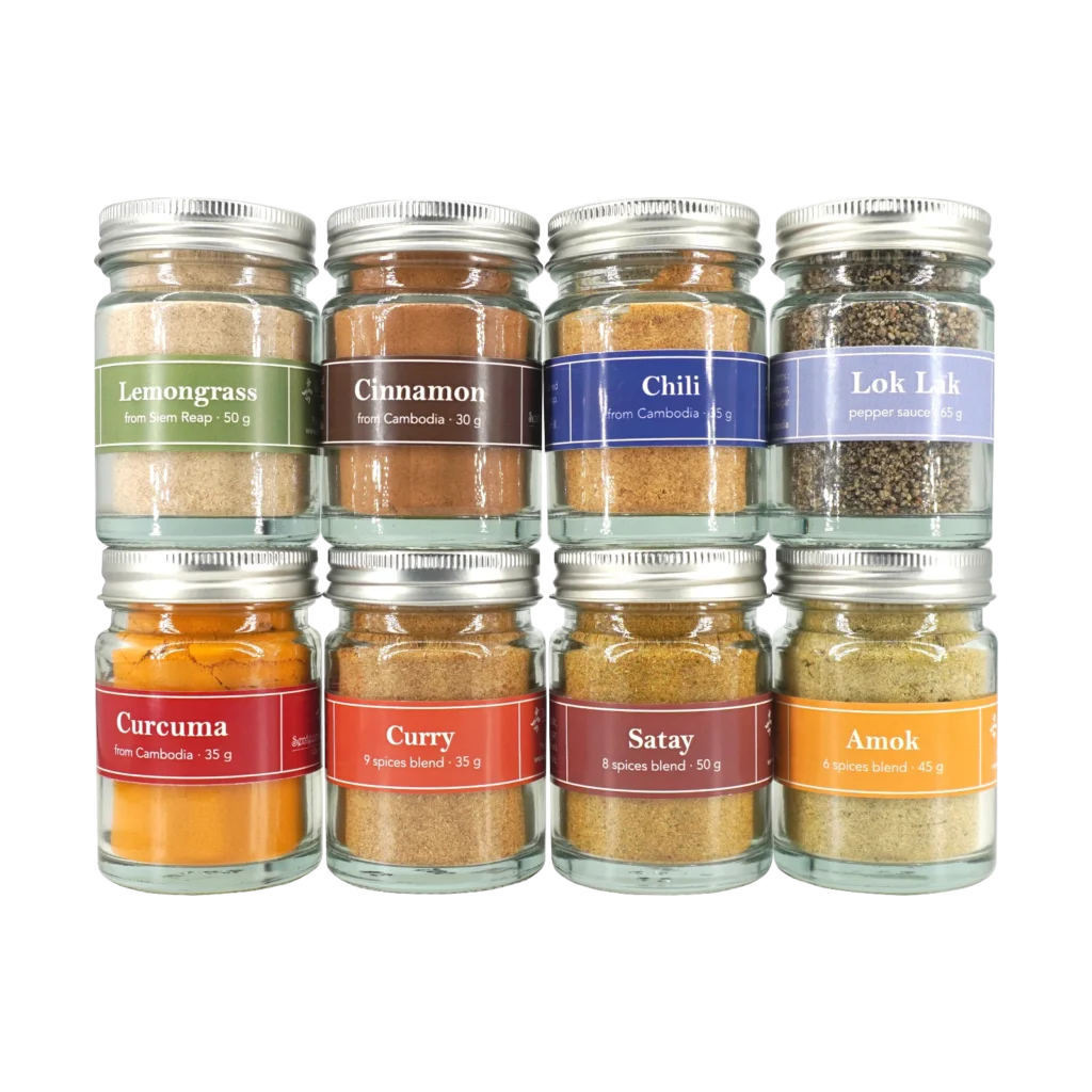 Spices in small glass jar, all spices front